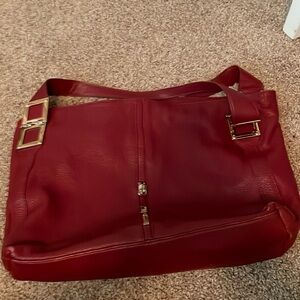 Red bucket bag. Measures 13h” by 17” 10” handle drop.